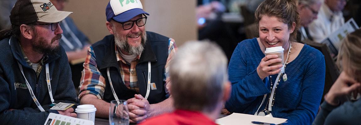 peolpe chatting and laughing at BuildingEnergy Boston