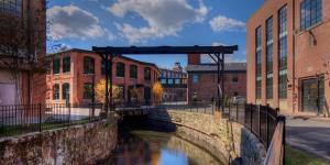 Exterior shot of Abbot Mill Complex, featuring canal