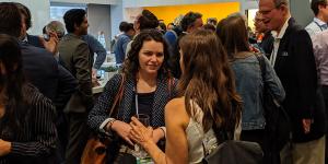 people chatting and eating at a Happy Hour