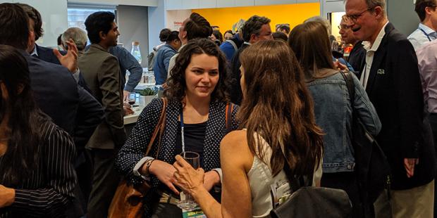 people chatting and eating at a Happy Hour