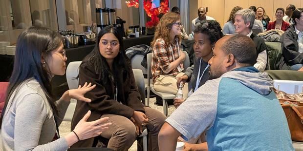 a group of people having a discussion together