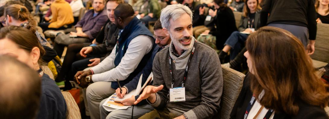 people chatting at a NESEA conference