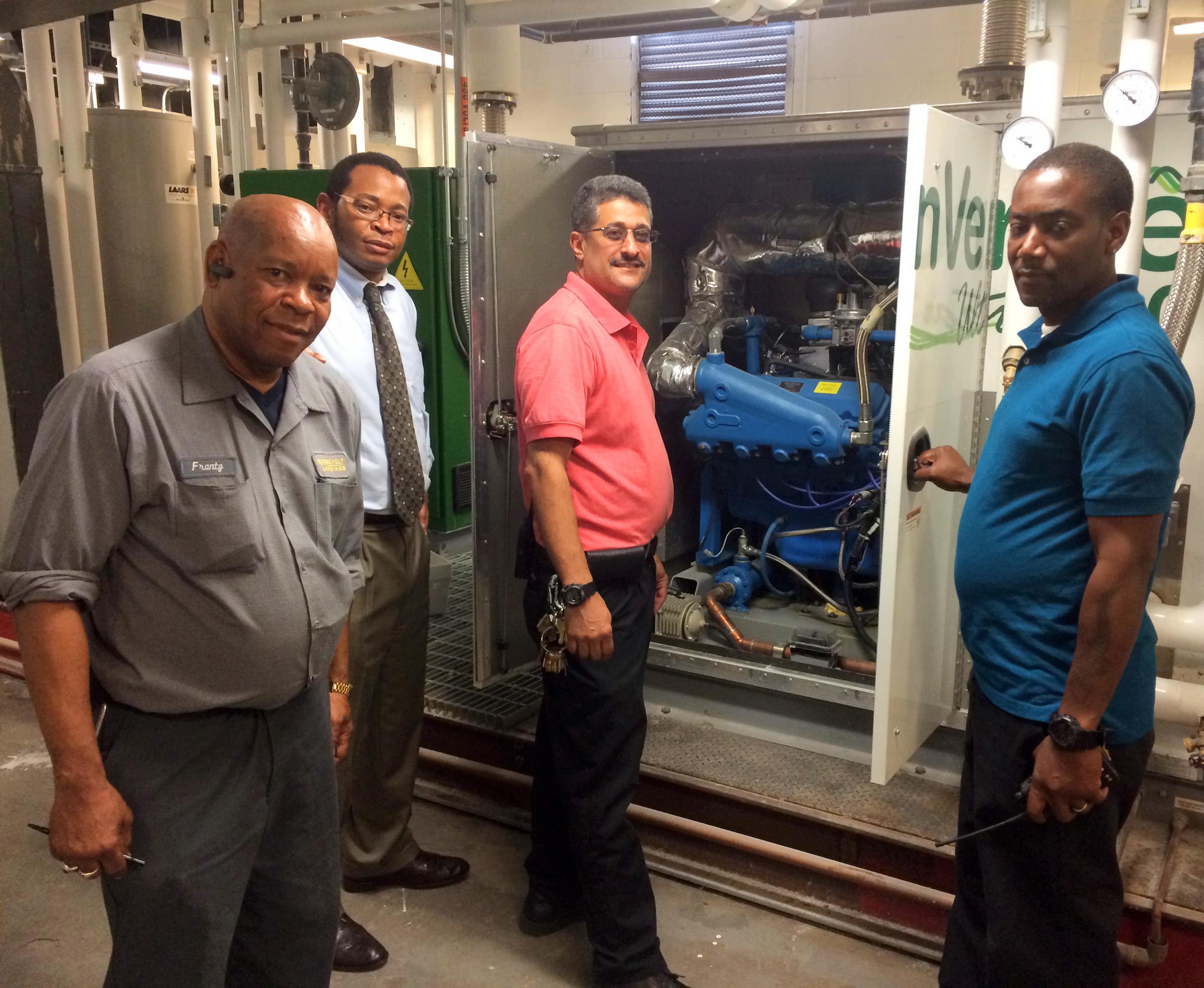 A TEAM INSPECTS hvAC EquIPMENT AT RooSEvELT LANDINgS oN JuNE 20, 2014.